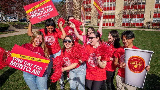 Students holding One Day for Montclair signs. 